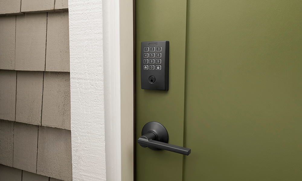 Schlage Arrive smart lock keypad in matte black with a matching door handle.