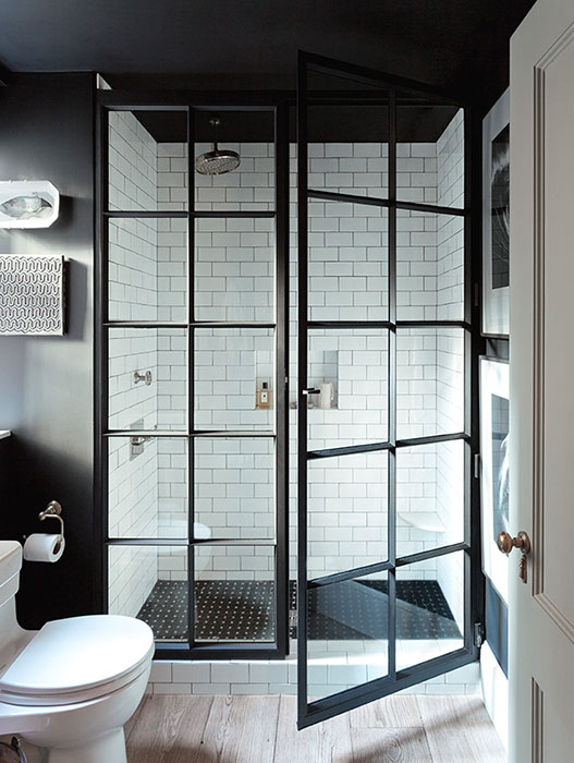 Bathroom with glass doors and mixed finishes.