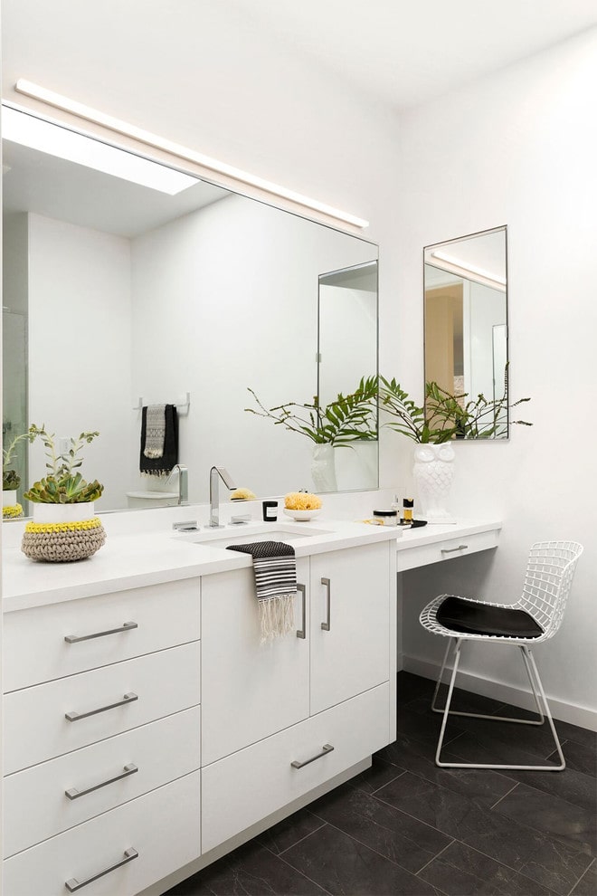 All white bathroom with bohemian plants