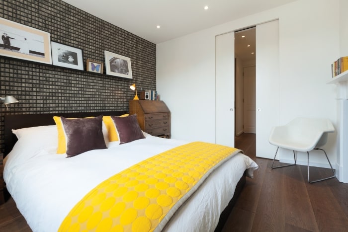 Contemporary style bedroom with pocket door.