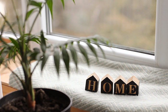 Cozy decor with wooden blocks spelling home.