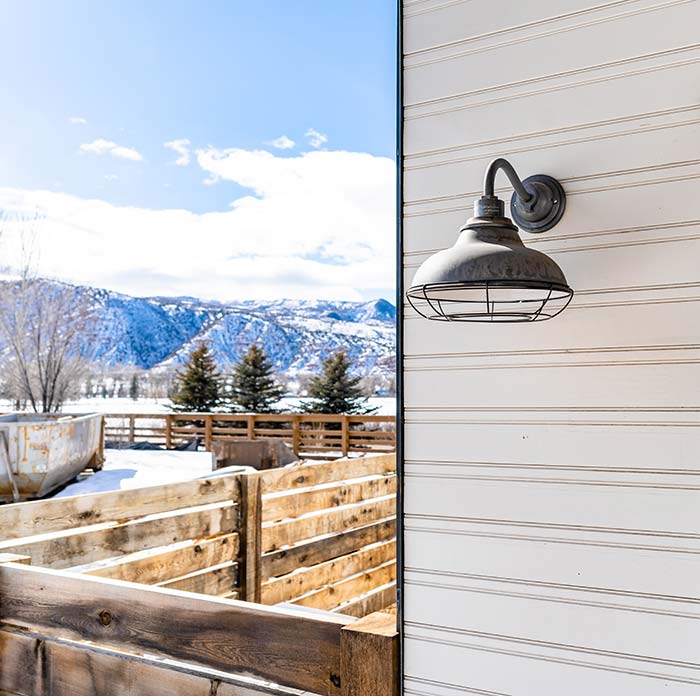 Modern farmhouse exterior during winter.