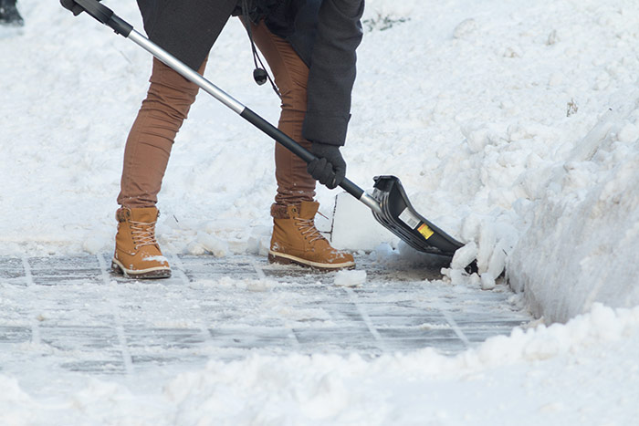 Person shoveling snow.