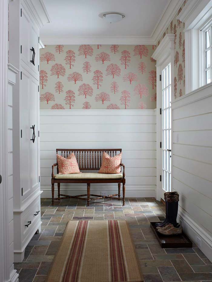 Country entryway with large print wallpaper and shiplap.