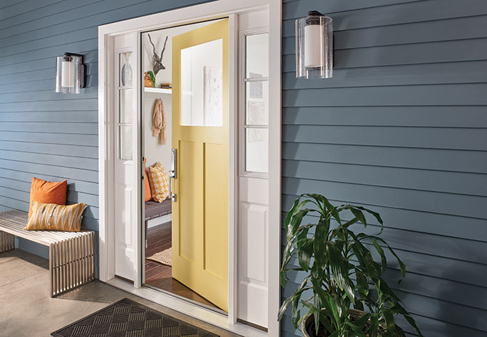 Yellow front door with Schlage Custom Handleset.