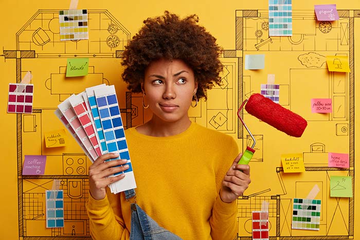woman-thinking-about-painting-home