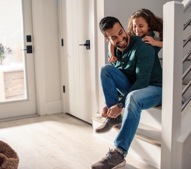 Dad with child enjoying their secure home.