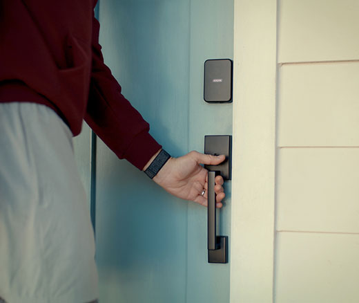 Schlage Sene Pro smart lock in matte black with a matching front door handle.