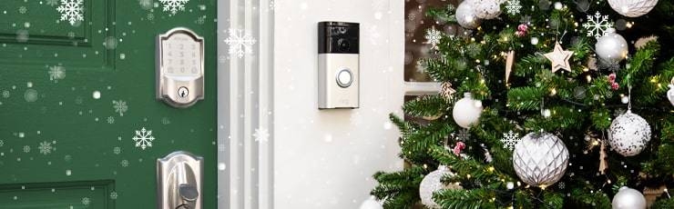 Schlage Encode wifi smart lock and Ring video doorbell with green front door and Christmas tree.